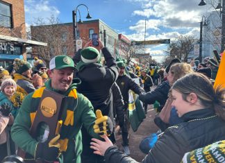 The UVM Men’s Soccer National Championship Matters to Vermont Families UVM men's soccer coach Rob Dow in celebration parade in downtown Burlington, Vermont