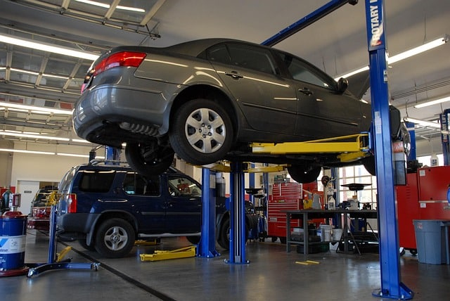 car lifted in the air at a mechanic